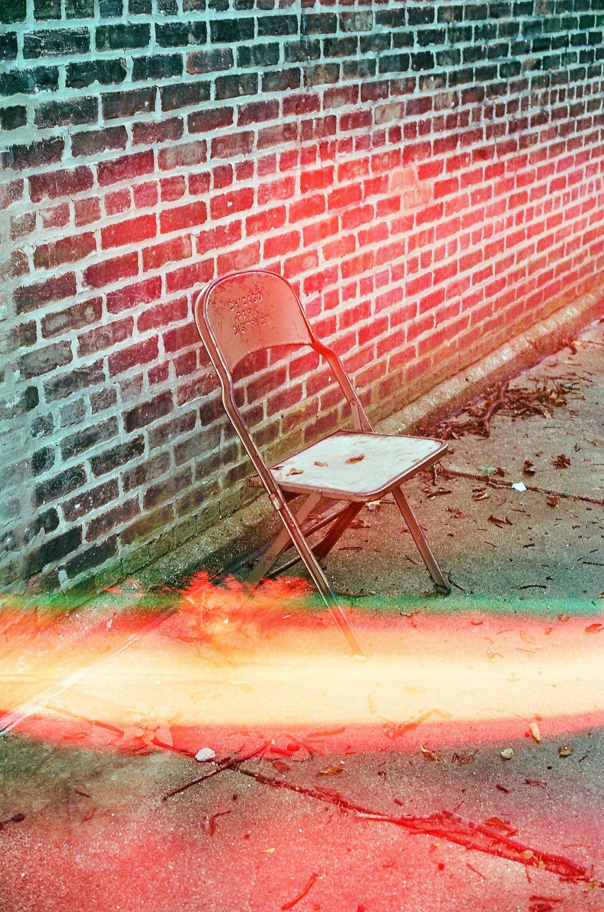 Rock formation and pier with light leak, Rogers Park, Chicago
